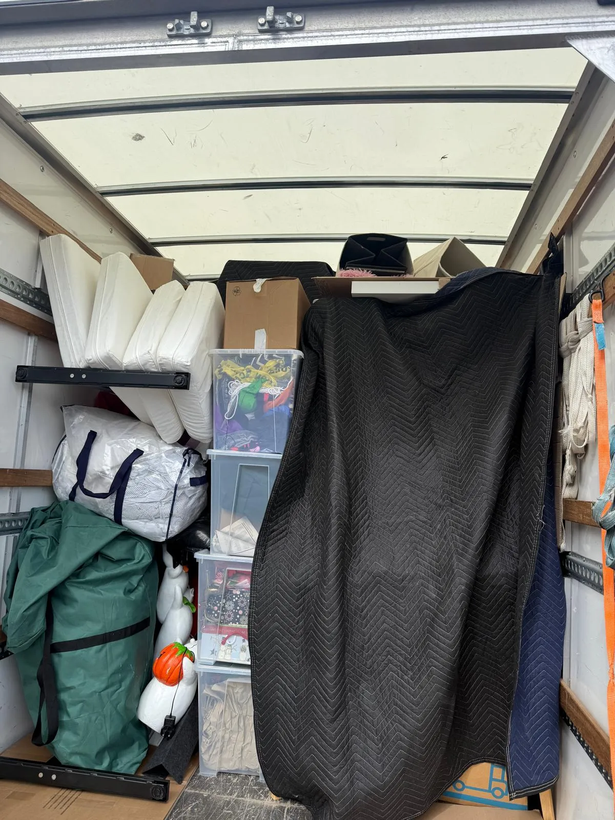 Furniture being moved carefully through a flat doorway