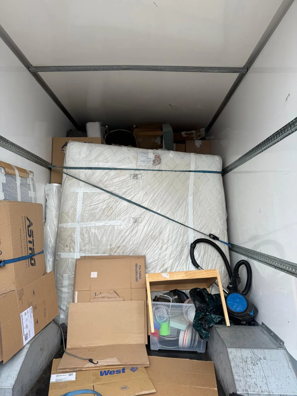 A loaded removal van prepared for a longer journey